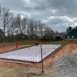 A construction site with a tarp covering the ground.