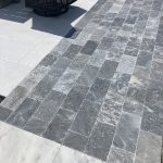 Dark gray and white marble tiles.