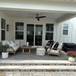 A back patio with a seating area and a grill.