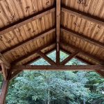 A wooden structure with a high vaulted ceiling.